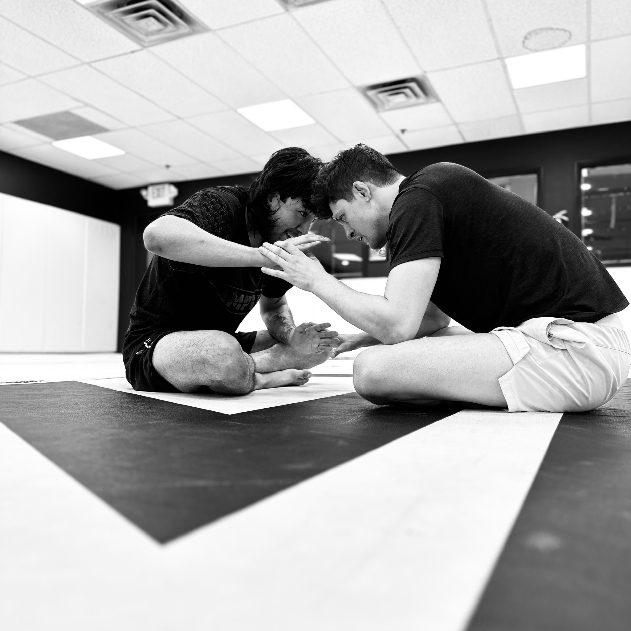 Two members working a grappling drill